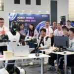 AGIBOT WORLD CHALLENGE 2026 Advances Embodied AI Competition from Simulation to Real-Robot Testing at ICRA 2026